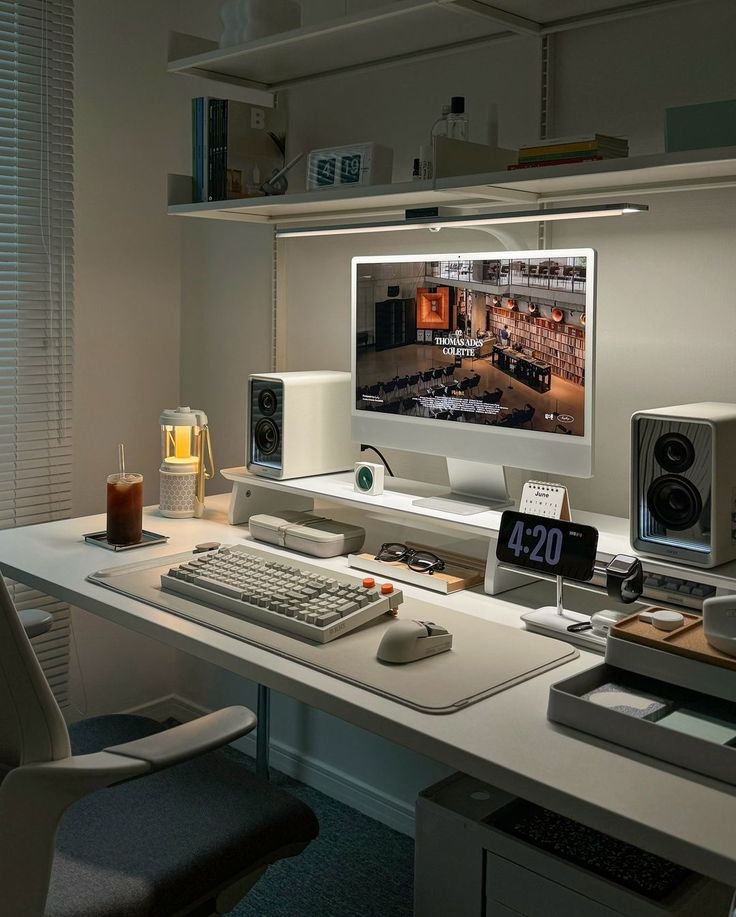 a computer desk with a monitor and keyboard