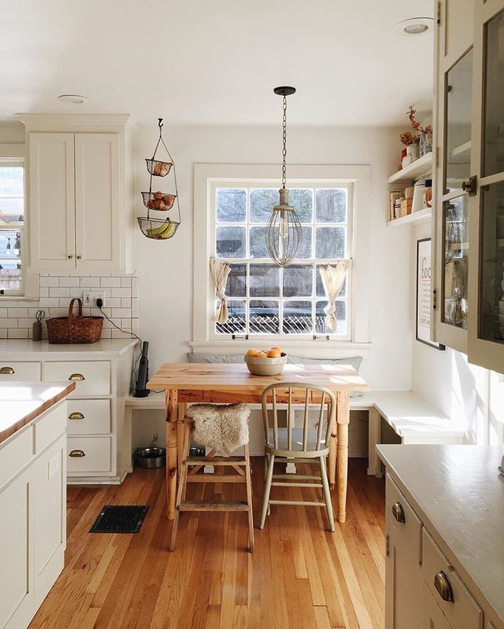 the kitchen is clean and ready to be used for cooking or dining, while also being used as a breakfast nook