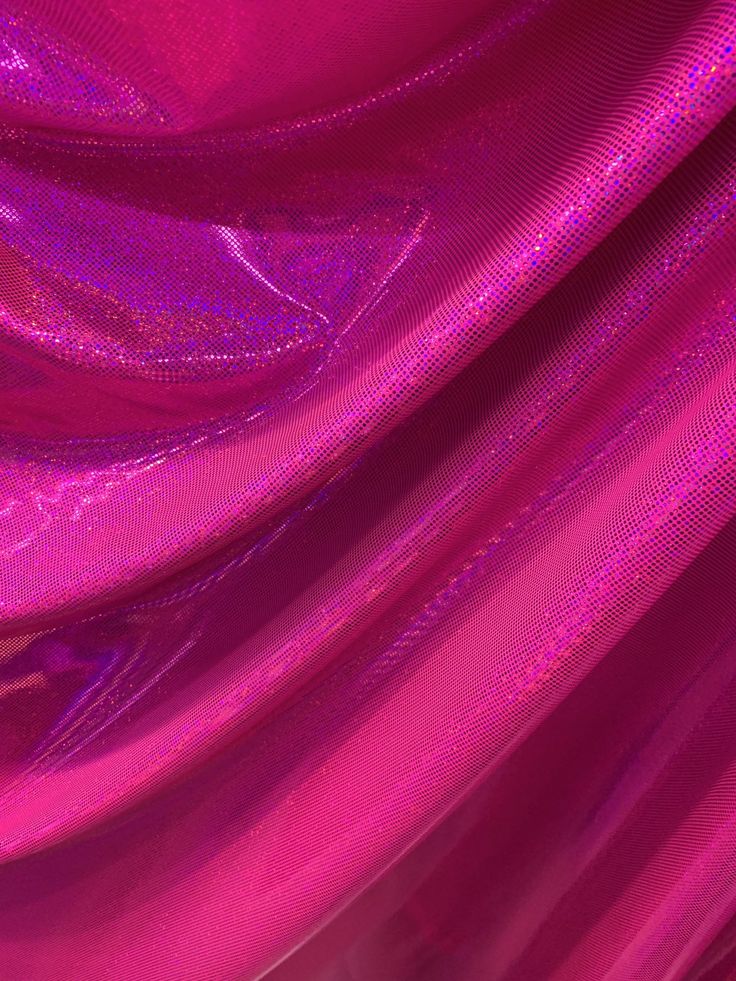 the fabric is shiny and bright pink with some light streaks on it's surface