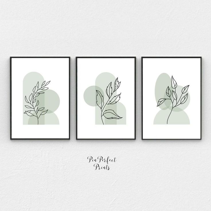 three framed art prints with leaves on them, one in green and the other in white