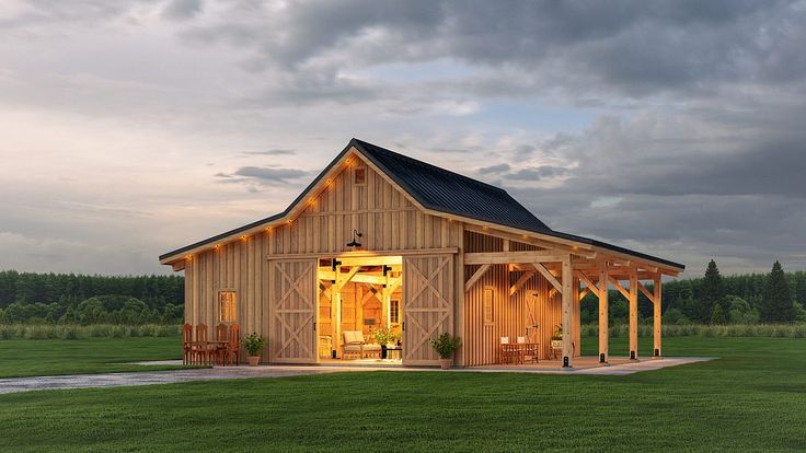 a large wooden building sitting on top of a lush green field