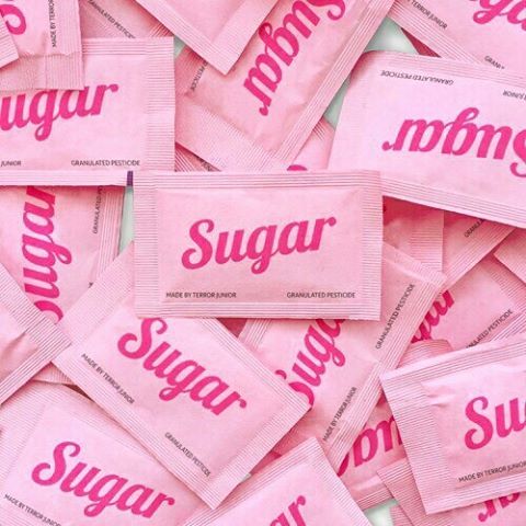 a pile of sugar packets sitting on top of each other