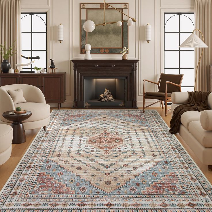 a living room filled with furniture and a rug on top of a hard wood floor