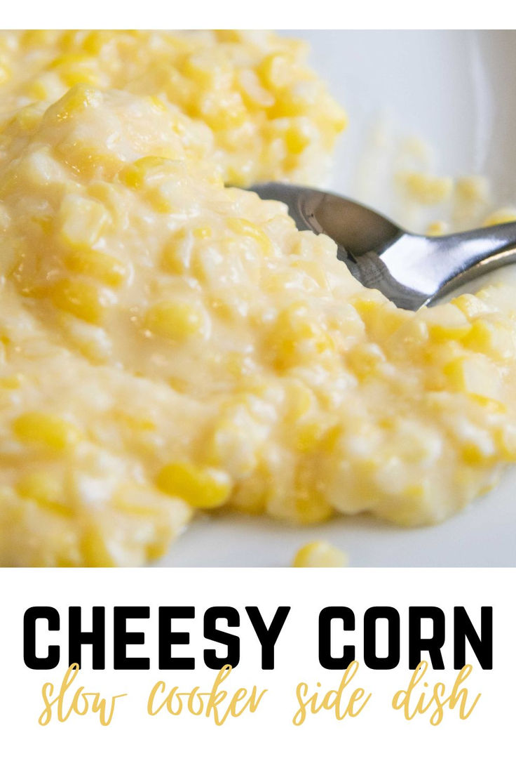 cheesy corn slow cooker side dish on a white plate with a spoon