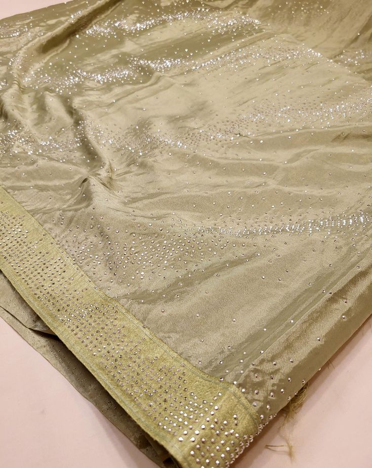 A stunning sage green chiffon saree with beading that can be perfect for any event (receptions, formals, parties, etc.)! This transparent piece has that silky body-hugging effect due to the light weight chiffon material. Blouse material is included (last image) and this saree can also be purchased in baby pink or baby blue! Elegant Green Pre-draped Saree For Celebration, Embellished Pista Green Pre-draped Saree In Georgette, Embellished Pista Green Georgette Pre-draped Saree, Green Blouse Piece With Dupatta For Evening, Green Pre-draped Saree With Mirror Work In Tissue Silk, Green Tissue Silk Pre-draped Saree With Mirror Work, Elegant Pista Green Dola Silk Pre-draped Saree, Green Pre-draped Tissue Silk Saree With Mirror Work, Elegant Green Blouse With Mirror Work