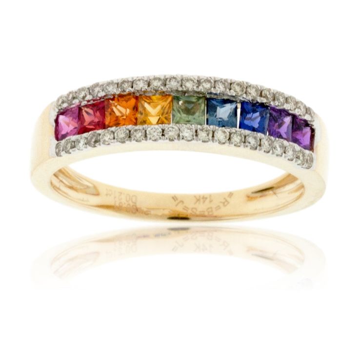 14K Yellow Gold Ring with .21ctw Diamond and .81ctw Rainbow Sapphire A stunning array of brilliant and lively colors is found at the center of this rainbow sapphire band. Princess cut sapphires are channel set in 14K yellow gold to represent the colors of the rainbow. Forty round diamonds are demi-pave set along either edge of the band to enhance the dramatic beauty of the multicolored center sapphires. Rainbows are often seen after a rainstorm when the sun breaks through the clouds. This provid Textured Gold Ring, Diamond Symbol, Rainbow Stone, Rainbow Ring, Alternative Wedding Rings, Rainbow Sapphires, Rainbow Rings, Round Sapphire, Sapphire Band