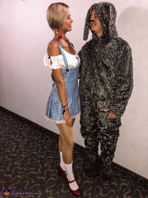 two people dressed in costumes standing next to each other