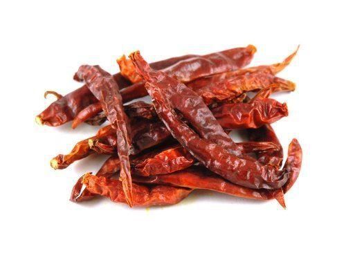 dried red peppers on a white background