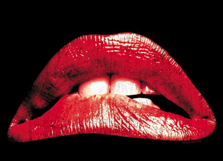 a woman's mouth with red lipstick on it