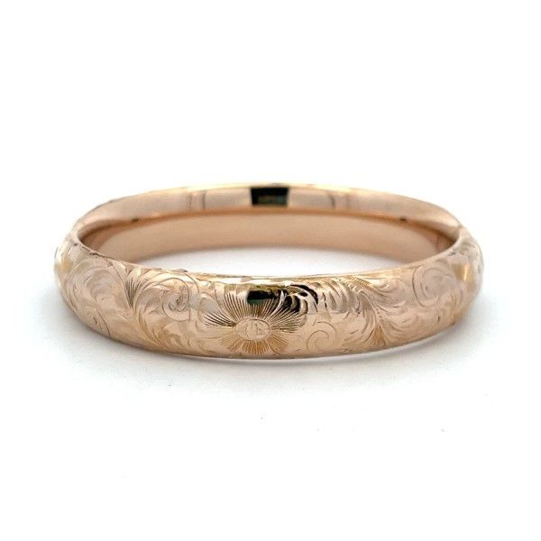 This estate bangle bracelet is crafted in 10Kt yellow gold and features an engraved design. The bracelet is wide and makes a statement on its own or stacked with other bracelets. A beautiful and unique addition to any jewelry collection. Classic Etched Bangle Bracelet, Classic Etched Bangle Bracelets, Engraved Rose Gold Cuff Bangle, Engraved Rose Gold Cuff Bangle Bracelet, Engraved Rose Gold Bangle Cuff Bracelet, Engraved Rose Gold Bangle Bracelet, Luxury Engraved Gold Bangle Bracelet, 14k Gold Bangle Bracelet With Intricate Design, Etched Yellow Gold Bracelet