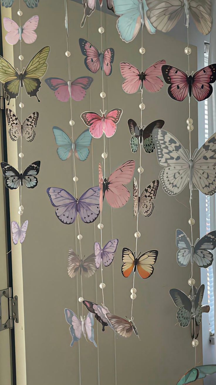 a mobile with many different colored butterflies hanging from it