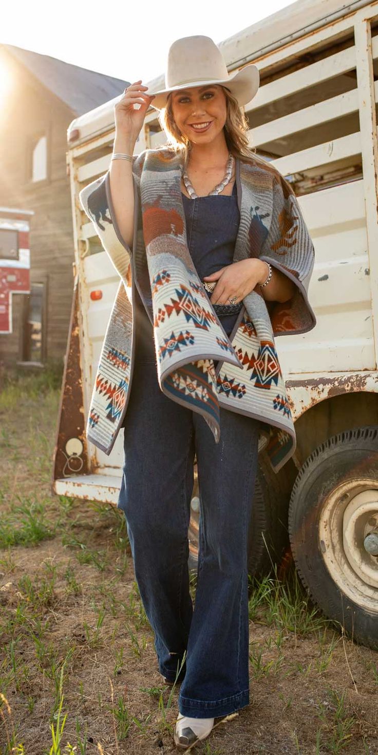 Prairie Rush Hour Wool Ruana This cozy wool ruana is an easy transition piece for Fall or Winter, slip your arms through and go. Gives just the right amount of warmth with its breathable open front style. Made from the popular Pendleton® Prairie Rush Hour Wool blanket, honoring bison that have roamed our prairies and valleys for millions of years and still do today as protected animals in the National Parks of North America. Napped wool gives the wool a slightly fluffy texture. Reversible, with Fluffy Texture, Animal Protection, Rush Hour, Wool Shawl, Wool Blanket, Shades Of Grey, Front Open, Rush, North America