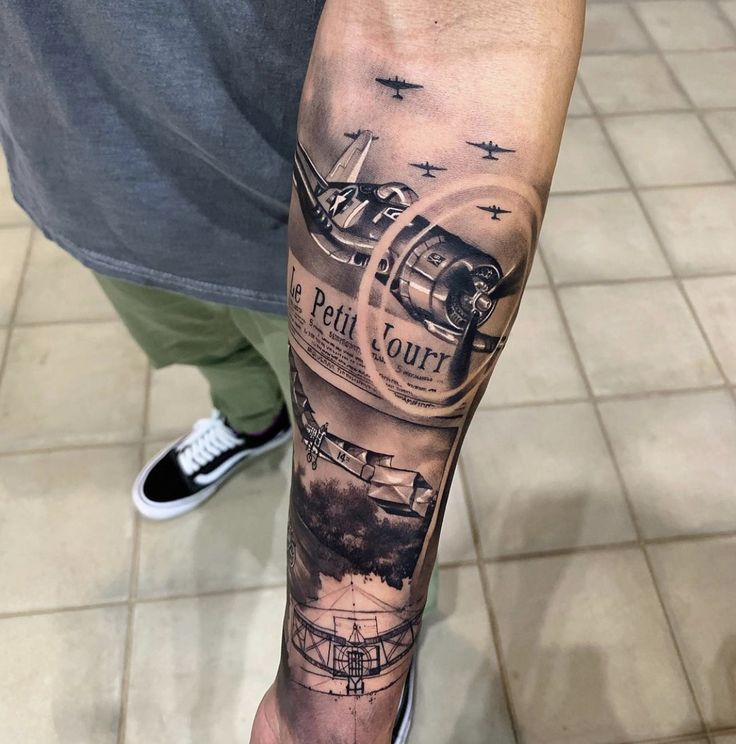 a man's arm with an airplane tattoo on it