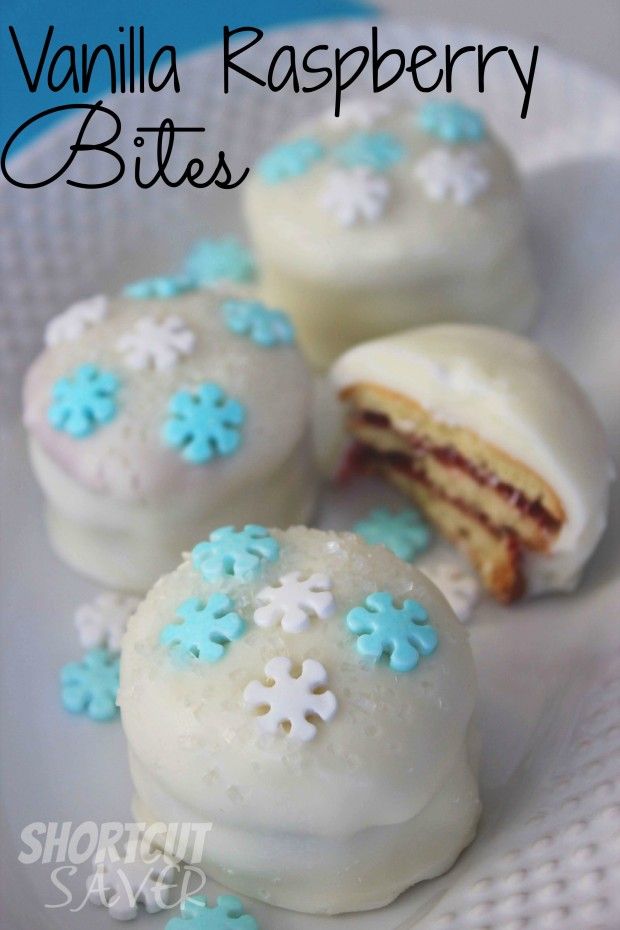 vanilla raspberry bites on a white plate with blue snowflakes around them