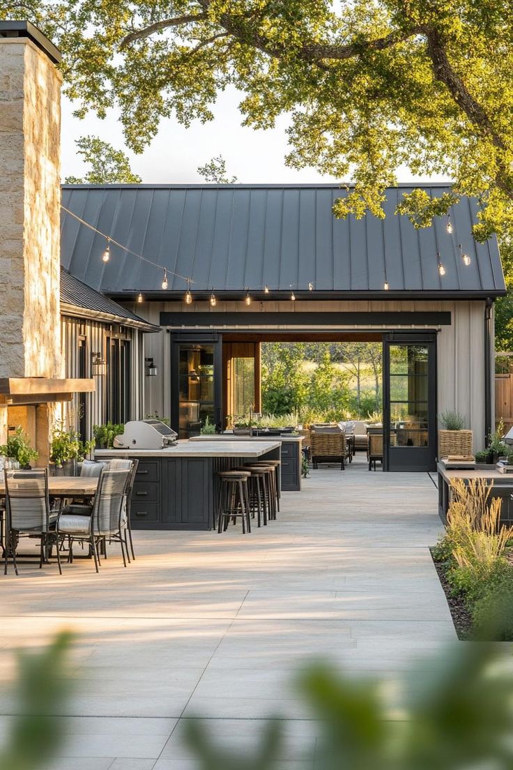 an outdoor kitchen and dining area is shown