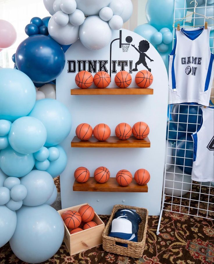 balloons and basketballs are displayed on shelves at a dunkin'donuts birthday party