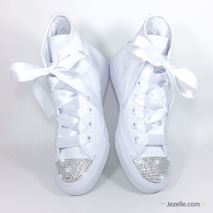 Our custom Swarovski Wedding Converse will have you twirling up the aisle in your own unique style. 🎉 You'll dazzle everyone with your brand new "Mrs." status with a sparkle that'll turn heads and make memories to last a lifetime. Bridal Converse that can be worn anywhere and for years to come will bring a smile to your face every time you look at your feet. We can create the perfect blinged out Converse for your wedding: Approximately 600 Genuine Swarovski Crystals per pair each hand-jeweled w Bedazzled Converse, Bridal Party Shoes, Converse Hi, Bridal Converse, Groomsmen Party, Converse Wedding Shoes, Bling Converse, Wedding Converse, Leather High Tops