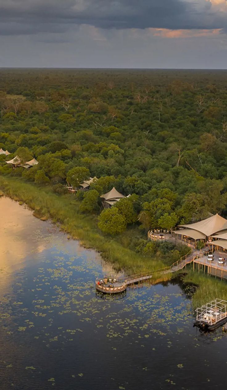 an aerial view of the lodge and surrounding water