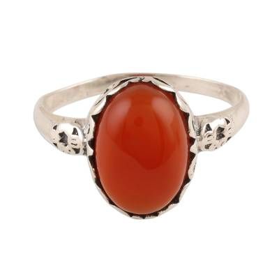 Glamorously beautiful this cocktail ring from India is presented by Alok Jain. Local artisans craft the ring of sterling silver caressing a large oval of red-orange carnelian with swirling vine motifs. Luxury Carnelian Oval Cabochon Rings, Oval Carnelian Orange Ring, Oval Orange Carnelian Rings, Orange Oval Carnelian Rings, Oval Carnelian Ring For Gift, Moonstone Pendant Necklace, Orange Carnelian, Ruby Pendant, Moonstone Pendant