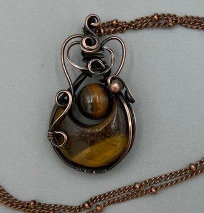 Wire wrapped Tigers Eye Pendant features a crescent moon and tigers eye 10 mm bead, copper bead and oxidized copper wire. It is 1.75 inches tall and 1 inch wide and comes with a free chain! Oxidized Copper, Eye Pendant, Tigers Eye, Beaded Pendant, Crescent Moon, Copper Wire, Tiger Eye, Tigers, Wire Wrapped