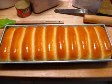 a loaf of bread sitting on top of a metal pan