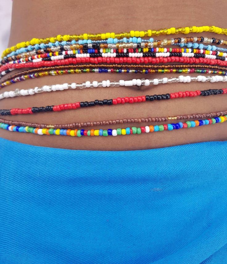 Waist beads have been worn by women for a very long time. They make a woman feel feminine and beautiful. Other reasons include; * Used as a waist control. They help shrink the waist as well as maintain figure. If the beads get tighter as you continue using them, you will know you are adding weight. Same case to losing weight if they become lose. *Some women use the beads to keep matters romantic hot. They adorn the beads to make their men happy. * The beads are used to make the waist noticeable. Beach Waist Beads With Gold Beads, Bohemian Waist Beads For Festivals, Bohemian Style Colorful Waist Beads, Bohemian Beaded Chain Waist Beads, Bohemian Tiny Beads Waist Beads For Festival, Bohemian Colorful Waist Beads For Festivals, Bohemian Waist Chain With Tiny Beads, Gift Waist Beads With Small Beads, Gift Waist Beads With Tiny Beads