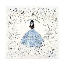 a white doily with a blue dress on it and a black bird in the center