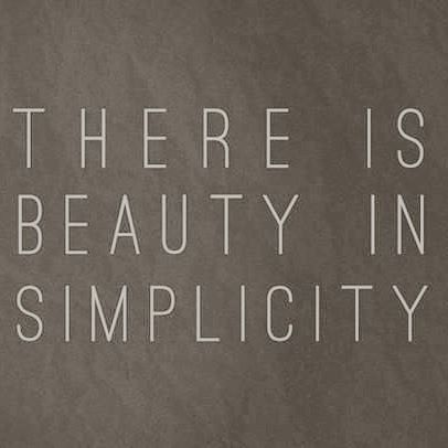 there is beauty in simplicity written on a blackboard with white lettering