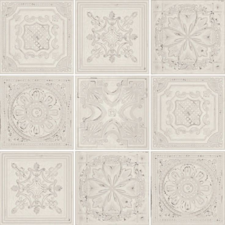 six white tiles with different designs on them