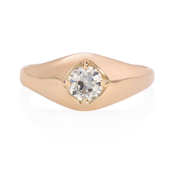 a gold ring with a diamond in the center