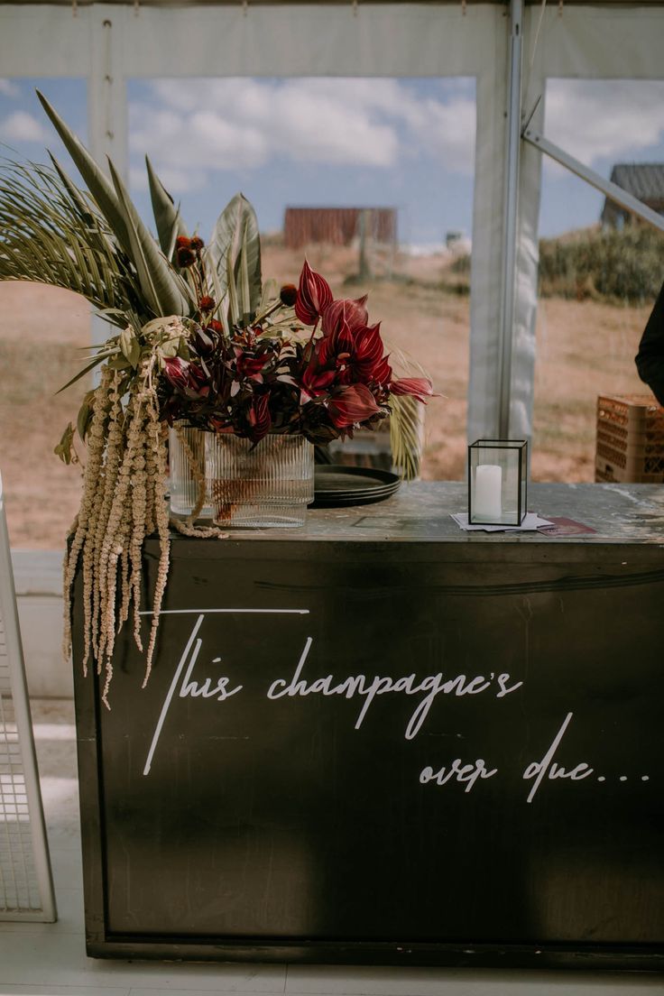 a sign that says this champagne is overflowing on the side of a table