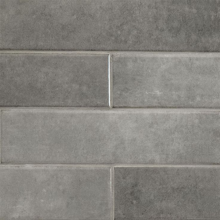 a close up view of a gray brick wall