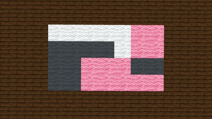 a pink and black block on a brown brick wall with the letter c in it