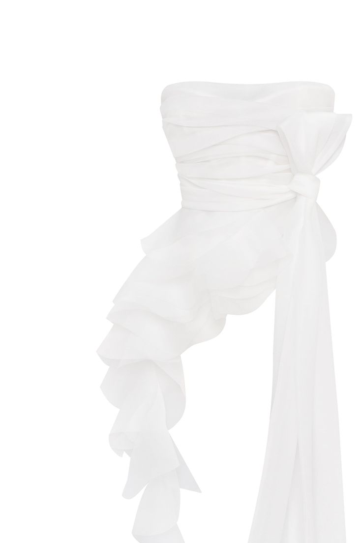 Charming blouse made from soft organza in a white color. The gathered bodice defines the waist, and detachable off-the-shoulder sleeves adorned with ethereal ruffles add a touch of romance to the look. Details: Material: Organza Fabric composition: 100% Polyester Sleeve style: Detachable off-the-shoulder Neckline: Straight Back: Open with a bow Model is: 173 cm / 80-60-92, wearing size S Art.N.: 2402-20 White Misty Rose Color, Asymmetrical Dress Casual, White Wedding Guest Dresses, Milla Dresses, Corsets Tops, Elegant Wedding Guest Dress, Classy Gowns, Corset Blouse, Princess Silhouette