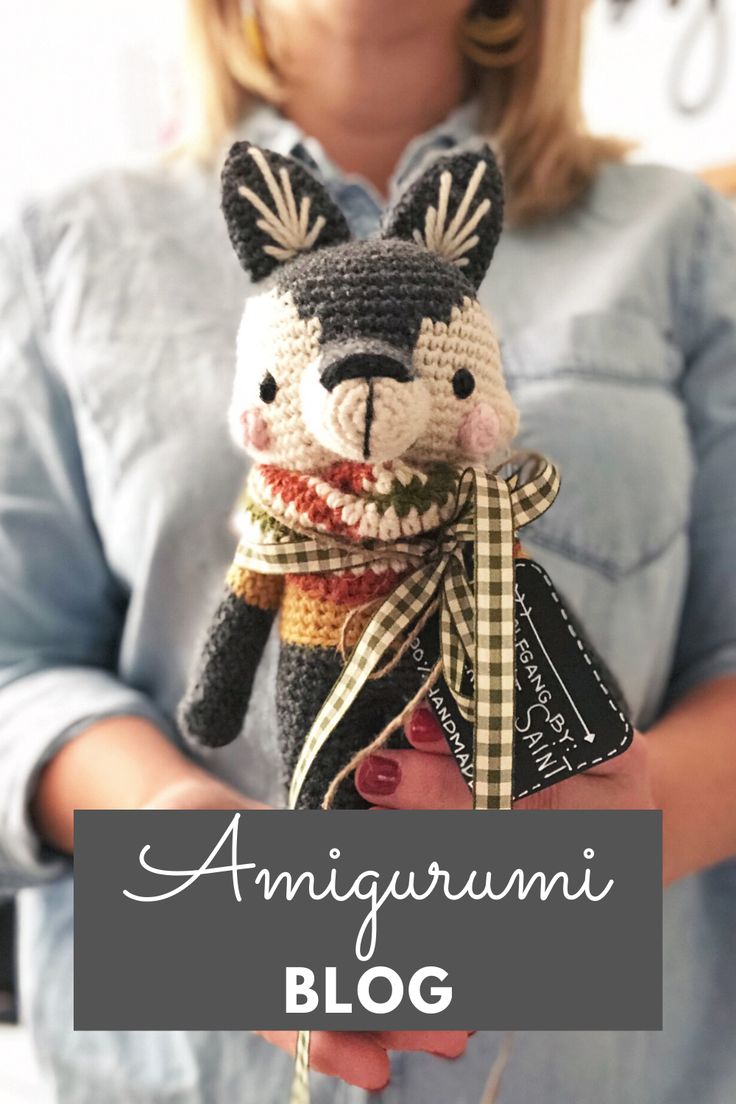 a woman holding a stuffed animal in her hands with the words amigurmi blog