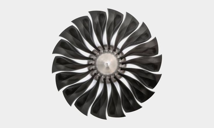 an airplane propeller spinning in the air with it's turbine blades showing white and black stripes