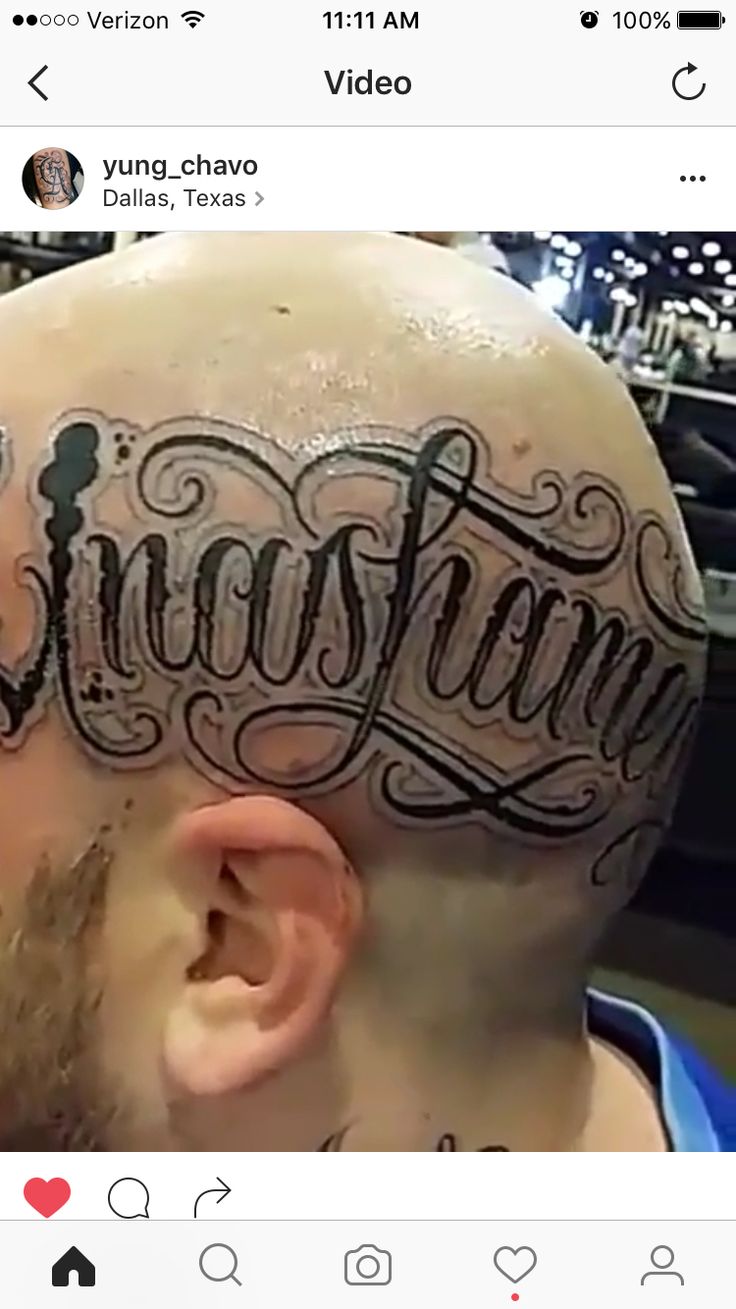 a man with tattoos on his head has the word's name tattooed on it