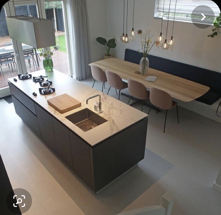 the kitchen is clean and ready to be used for dinner or other entertaining purposes in someone's home