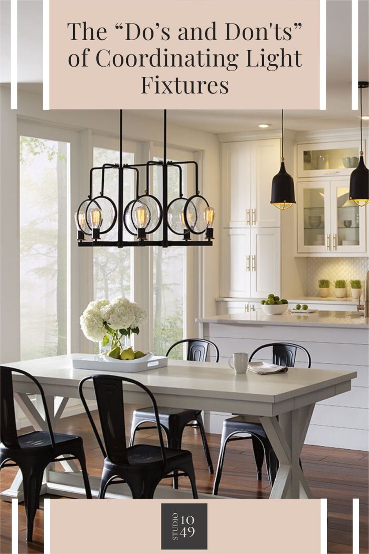 a dining room table with four chairs and a chandelier hanging from the ceiling