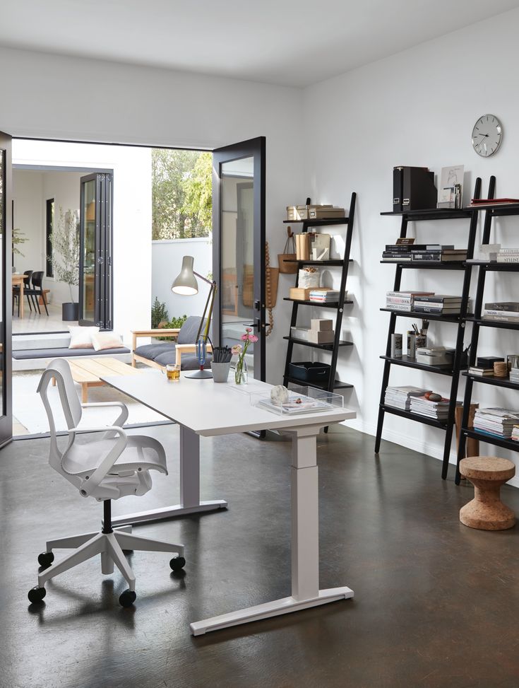 an office with a desk, chair and bookshelf in the background is shown