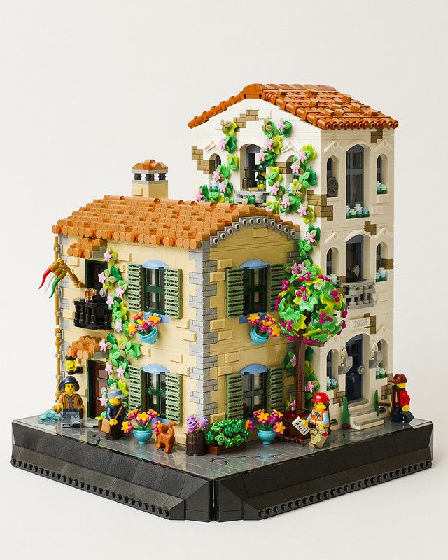 a lego model of a house with flowers on it