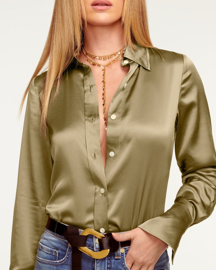 Polished in design, our Victoria Button Down Blouse is our new wardrobe staple on the rise. The slim-fitting button down silhouette gets an elevated spin thanks to the stretch charmeuse fabrication, designed for a comfortable fit. Take the buttons as high or low as you please to make this style your own. Size & Fit – Fits true to size, take your normal size– Model is Wearing Size XS– Model is 5'9" Size Guide Details & Care – Stretch Charmeuse – Dry Clean or Hand Wash – Style #: A0822218 Free Del Sue Barker, Satin Design, Blouse Nylon, Satin Clothes, Satin Button Up, Satin Bluse, Minimalist Shirts, Stylish Women Fashion, Ramy Brook