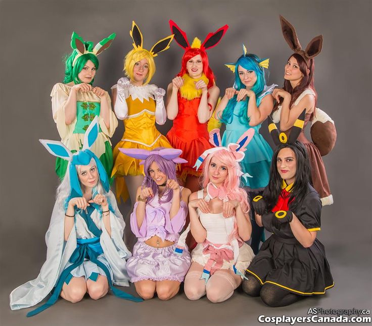 a group of women dressed in costume posing for a photo