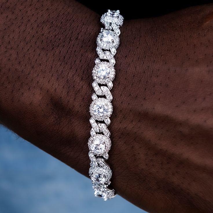 Introducing the Iced Diamond Station Cuban Bracelet in 14k White Gold. This striking piece features striking diamonds embossed in hand-set stones, stationed between iced out Cuban links. Sure to be noticed from across the room, this GLD exclusive is perfect for complementing any look from day to night. Pair it with the Iced Diamond Station Cuban Chain for a matching set! This product is guaranteed for life – GLD will repair or replace the item should you experience any defects in craftsmanship o Cuban Bracelet, Diamond Ice, Vermeil Jewelry, Custom Earrings, Cuban Chain, Drop Necklace, Pendant Bracelet, To Night, Chain Pendants