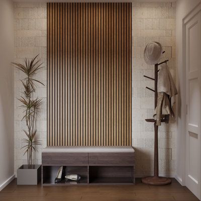 a hallway with a bench, coat rack and potted plant