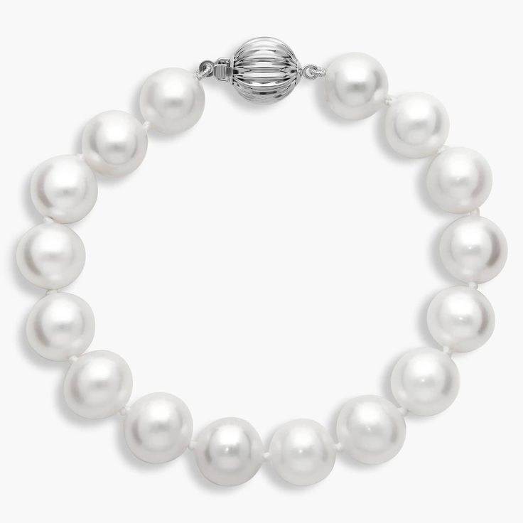 Add a timelessly sophisticated touch to your style with this simple yet classic bracelet of softly gleaming 9-10mm freshwater pearls. The white gold design promises enduring quality and luxury. Luxury White Pearl Jubilee-style Bracelet, Luxury White Gold Pearl Oyster Bracelet, Luxury White Gold Pearl Jubilee Bracelet, Luxury White Gold Bracelets With Pearl Chain, Luxury White Gold Pearl Chain Bracelets, Timeless White Gold Pearl Bracelet For Anniversary, Luxury Pearl Drop Bracelet For Formal Occasions, Timeless Silver Pearl Bracelet For Formal Occasions, Elegant White Gold Pearl Jubilee Bracelet