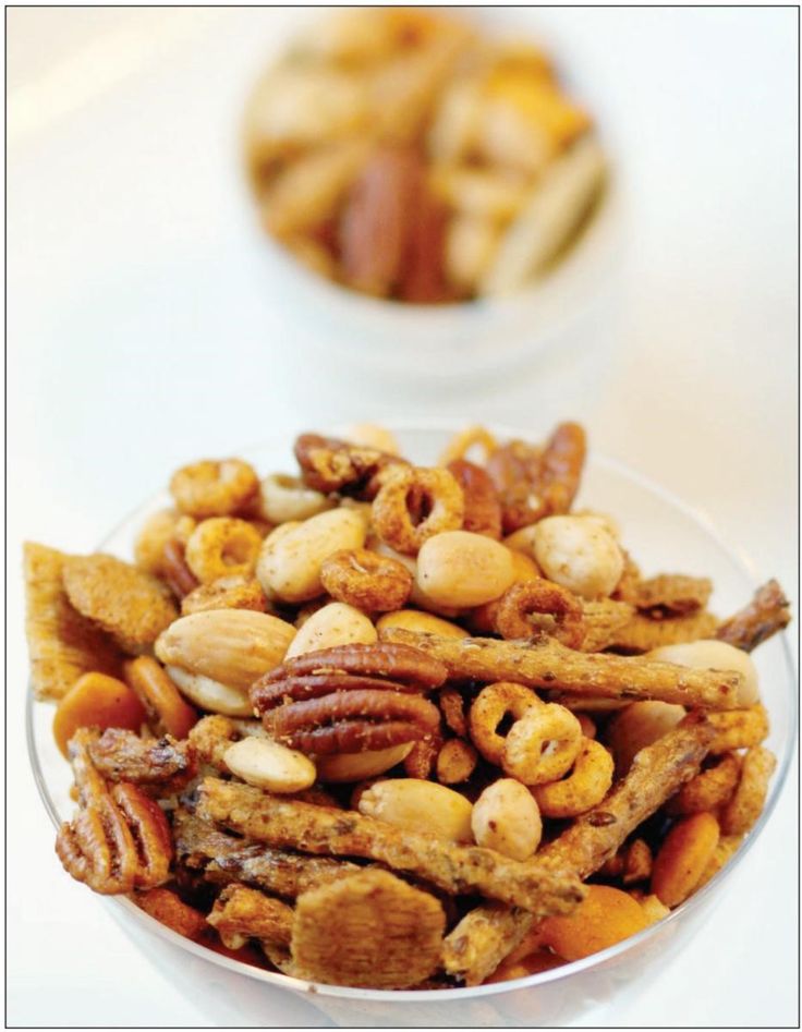 a bowl filled with nuts and other food items