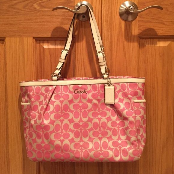 NWOT Coach Signature Bag NWOT Coach Signature Print bag. Never been used -- in excellent condition. Approx size is 14.5"L x 5"W x 10.5"H Coach Bags Pink Large Capacity Shoulder Bag For Errands, Pink Satchel For Everyday, Pink Large Capacity Diaper Bag For Everyday Use, Large Capacity Pink Diaper Bag For Everyday Use, Pink Satchel With Removable Pouch And Double Handle, Pink Double Handle Satchel With Removable Pouch, Pink Double Handle Satchel For Shopping, Pink Tote Satchel For Everyday Use, Pink Satchel For Errands