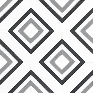 a black and white tiled floor with an abstract design in the shape of diamond shapes