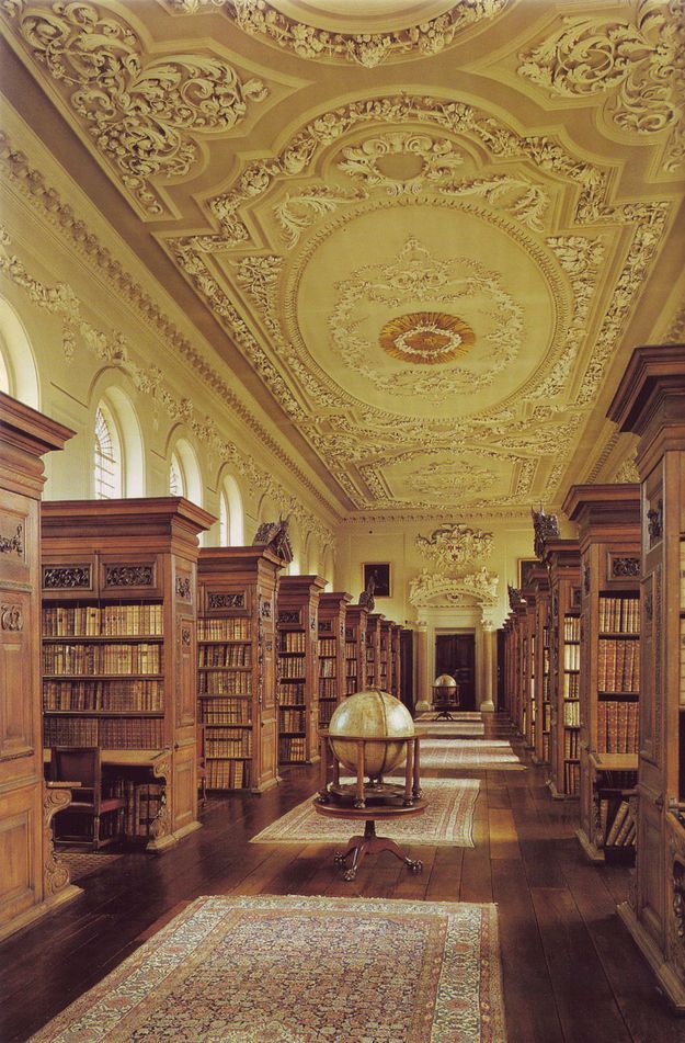 an ornately decorated library with many bookshelves